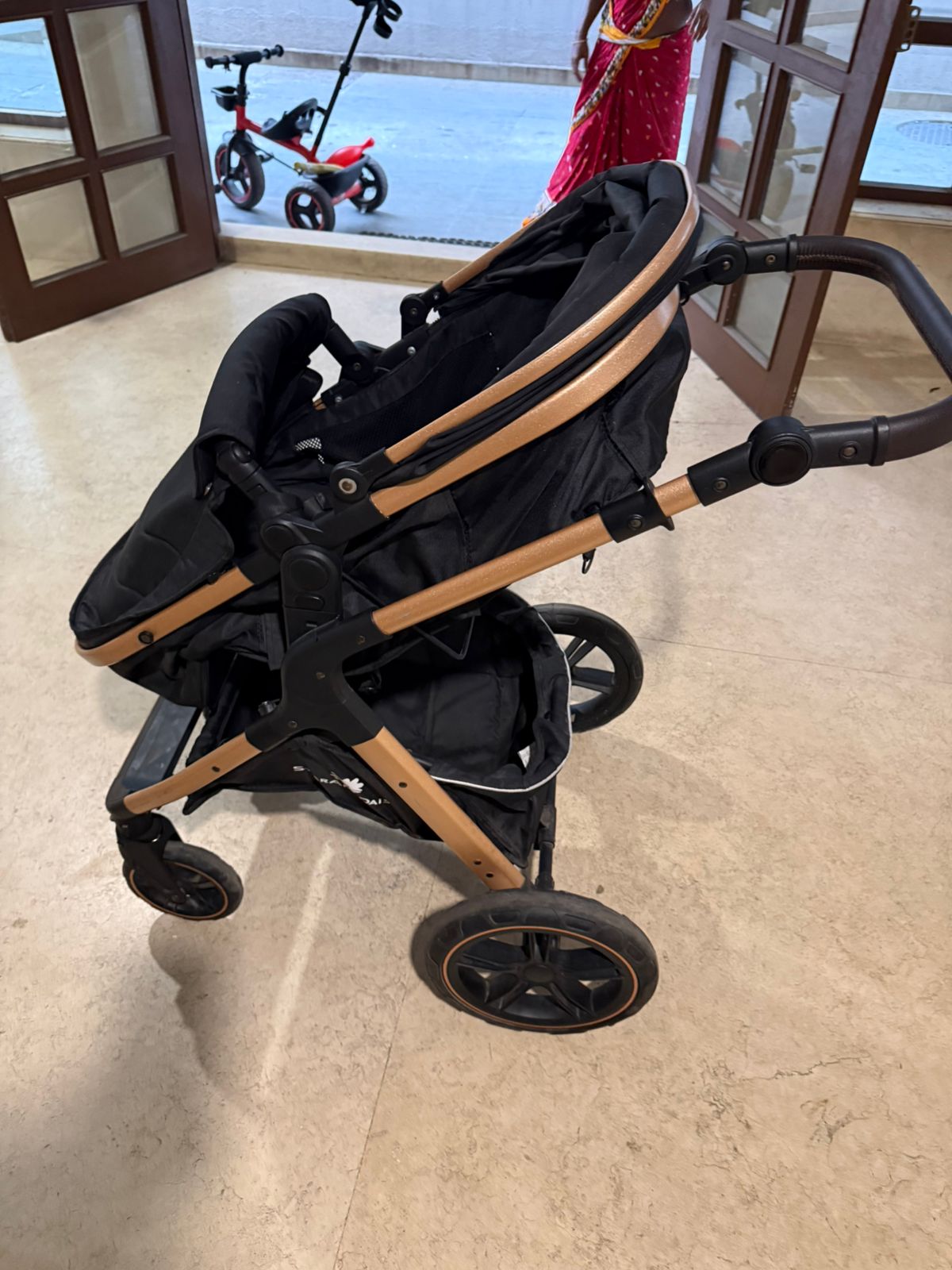 StarAndDaisy EasyGo Premium Baby Strollers Prams with Reversible Bassinet Design, High Landscape Seat, One-push Folding, Powerful Shock Absorption Wheels (Black with Golden Tubes)