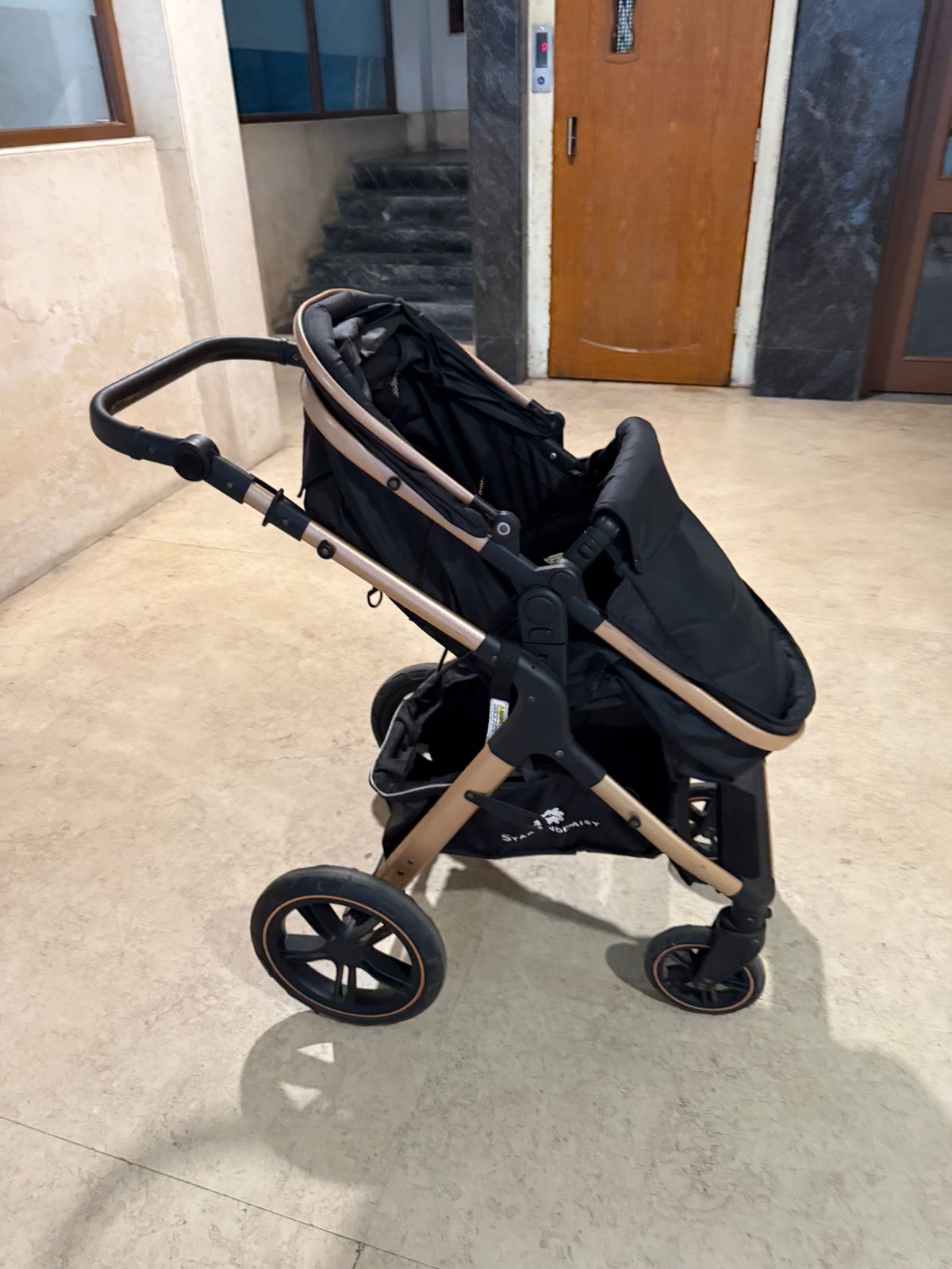 StarAndDaisy EasyGo Premium Baby Strollers Prams with Reversible Bassinet Design, High Landscape Seat, One-push Folding, Powerful Shock Absorption Wheels (Black with Golden Tubes)