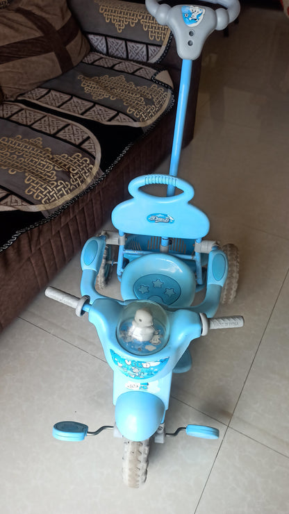 Musical Tricycle with Parental Handle, Storage Basket, Music and Lights, Safety Harness for Kids, and Capacity Upto 20 kg (1 to 4 Years, Blue)